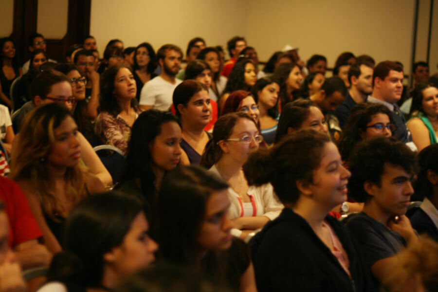 An engaged audience of students listening to a seminar delivered by SOS